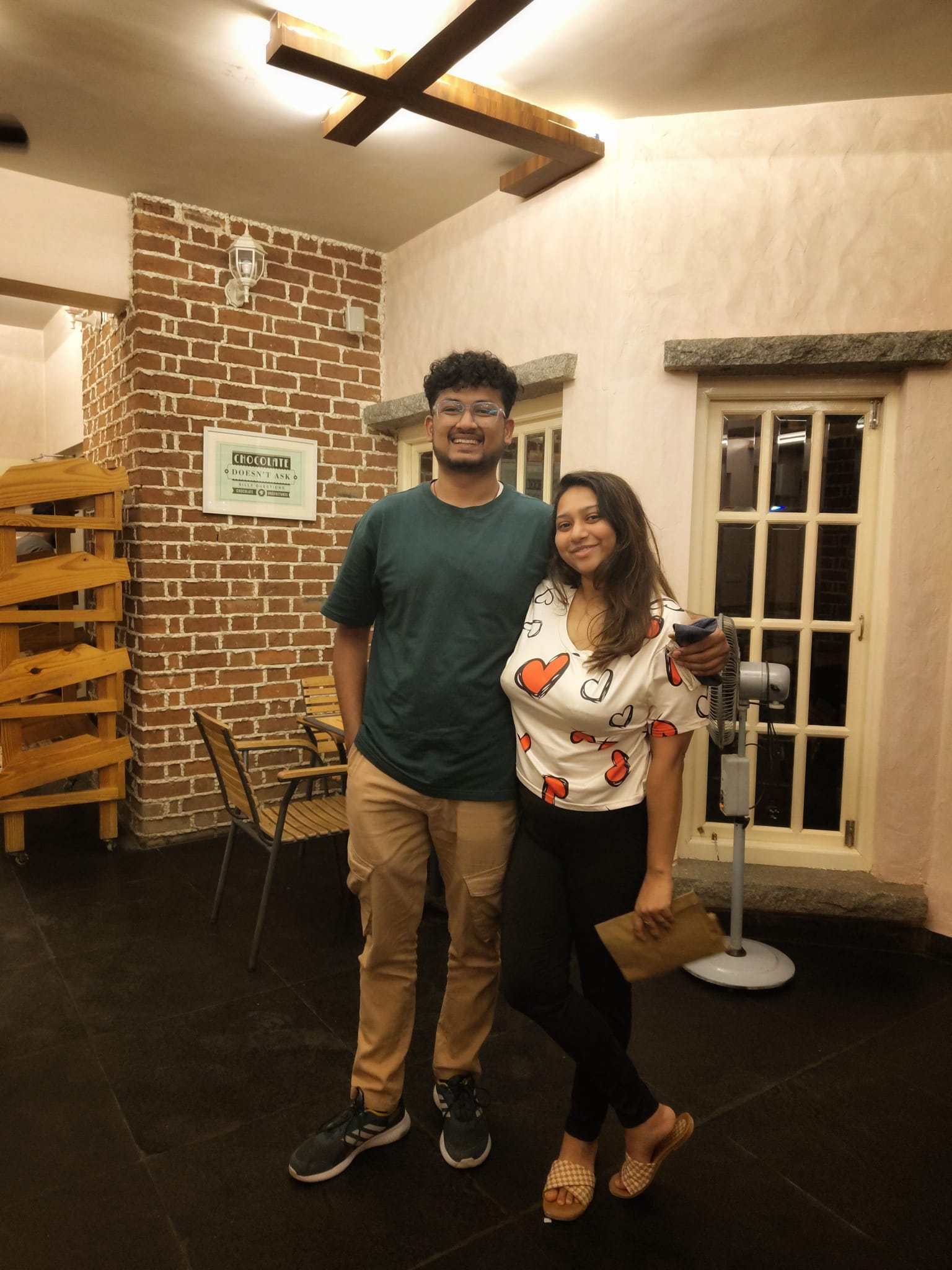 Rajshree and Deepesh together at a cozy cafe